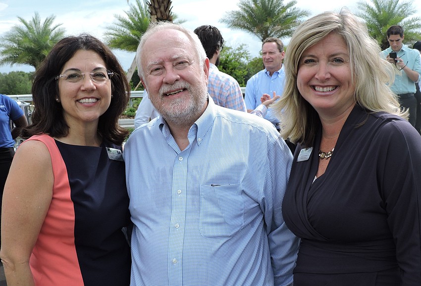 East County Observer Associate Publisher Lori Ruth, SMR CEO Rex Jensen and LWRBA Executive Director Heather Kasten share a laugh at the ribbon cutting.
