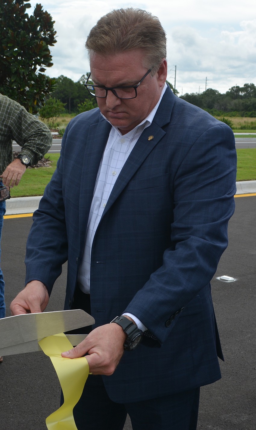 Sarasota County Commissioner Mike Moran gets a Lorraine Road extension souvenir.