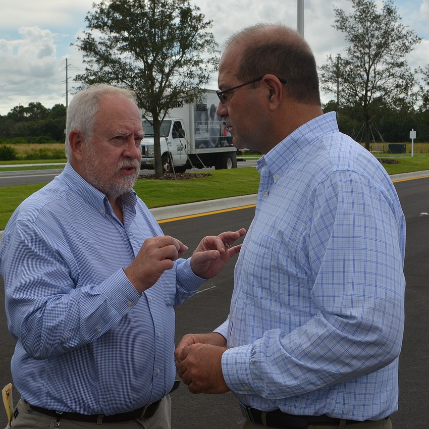 SMR CEO Rex Jensen discusses the project with Sarasota County Administrator Tom Harmer.