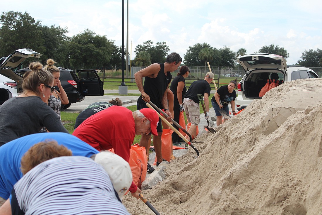 East County residents fill their sand bags at Lakewood Ranch Community Park on Wednesday after the county declared a state of emergency.