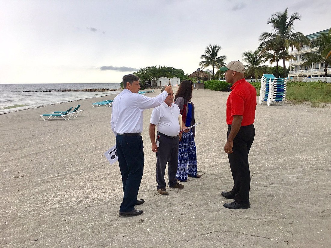City officials meet at Lido Beach on Wednesday to discuss the viability of placing large sandbags along the shore to mitigate the impact of storm surge. Photo courtesy city of Sarasota.