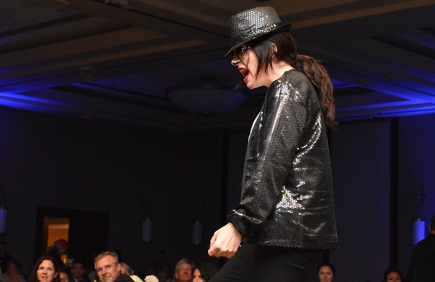 Kristy Lochead, acting as a Michael Jackson impersonator, performed a lip sync routine as a kickoff to the Women’s Council of Realtors Sarasota 2017 Fashion Show: “The Pieces Make the Whole” on Sept. 6 at Hyatt Regency Sarasota.