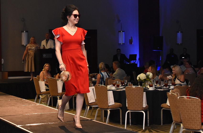 Olga Ovchiyan struts her stuff on the runway during the Women’s Council of Realtors Sarasota 2017 Fashion Show: “The Pieces Make the Whole” on Sept. 6 at Hyatt Regency Sarasota.