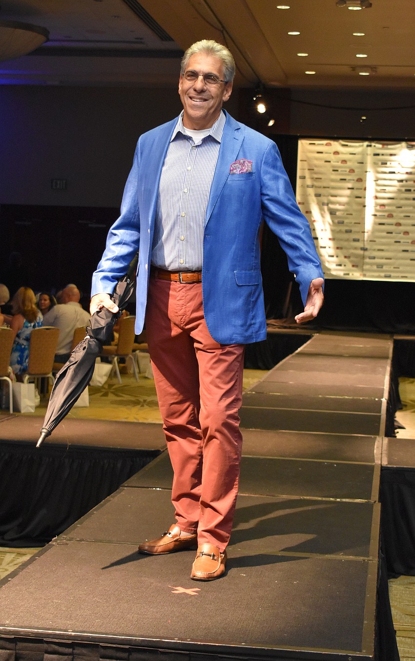 Harvey Wasserman strikes a pose on the runway during the Women’s Council of Realtors Sarasota 2017 Fashion Show: “The Pieces Make the Whole” on Sept. 6 at Hyatt Regency Sarasota.