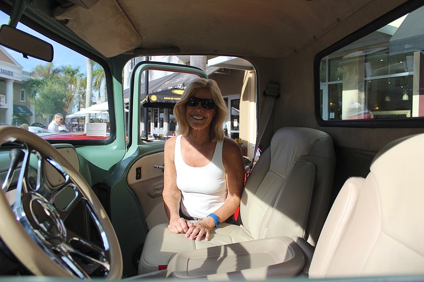 River Place's Ruth Conley ventures inside a show car on Main Street at Lakewood Ranch.