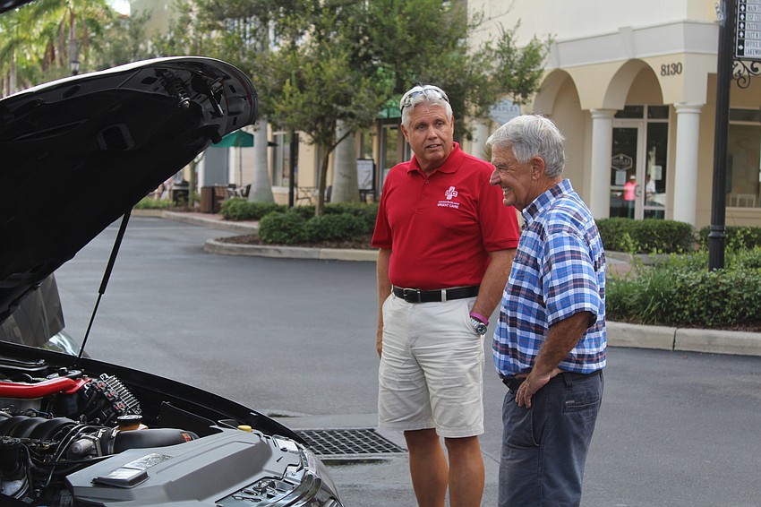 University Park's Rick Kimsey and Lakewood Ranch's Paul Jackowski check out an engine.