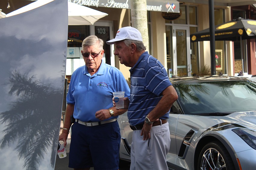 River Club's Joe Brisley and Fred Ferris discuss the interior of a show car.