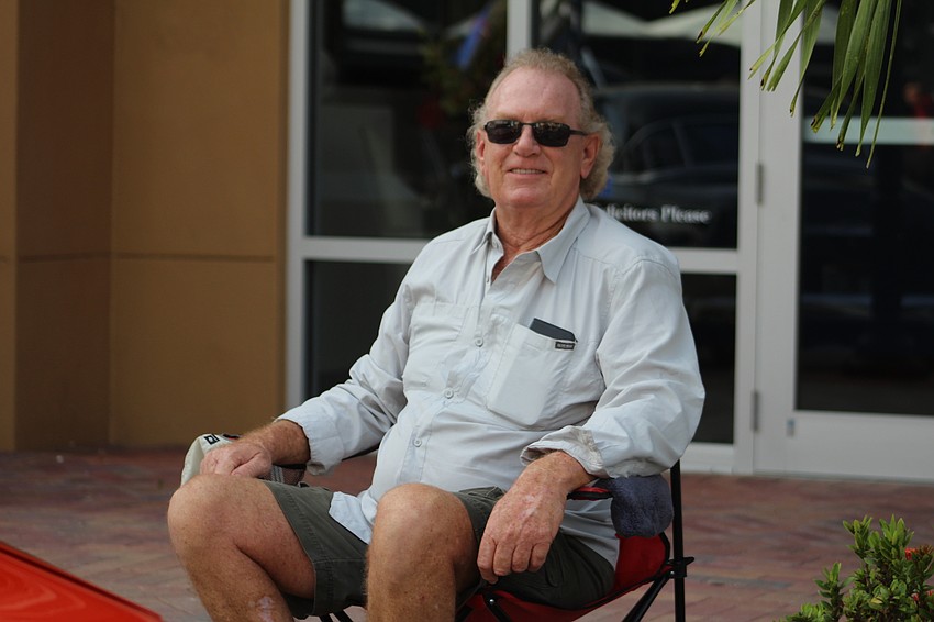East County's John Azar sits back and relaxes by his show car during the 