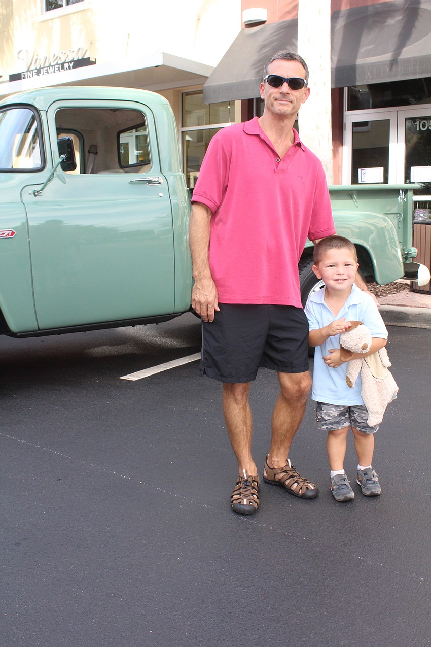 Lakewood Ranch's Ken and Abner Beck spend some father-son time at the car show on Main Street.