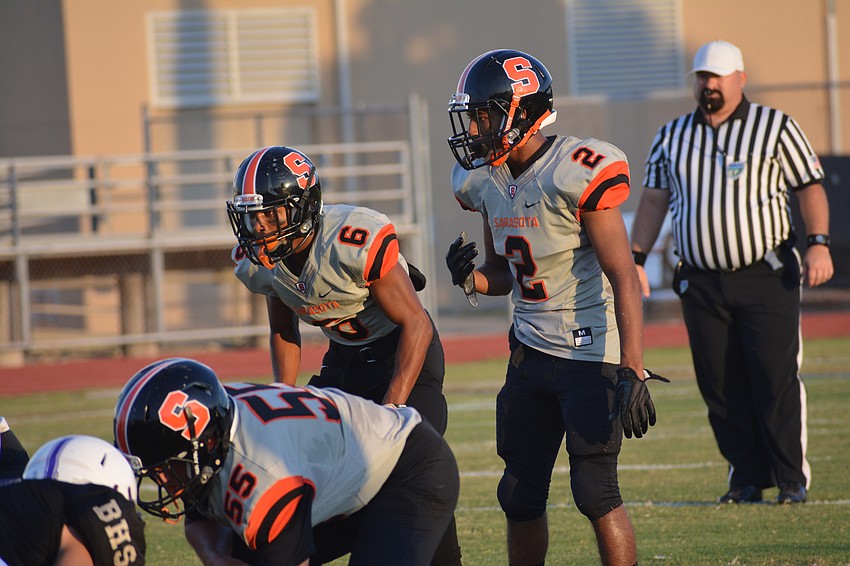Sarasota's Brian Battie and Tommie Battie IV stand together in the backfield.
