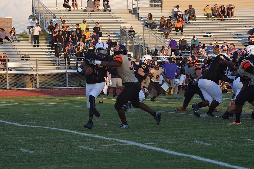 Booker's Talik Keaton fights off a Sarasota defender.