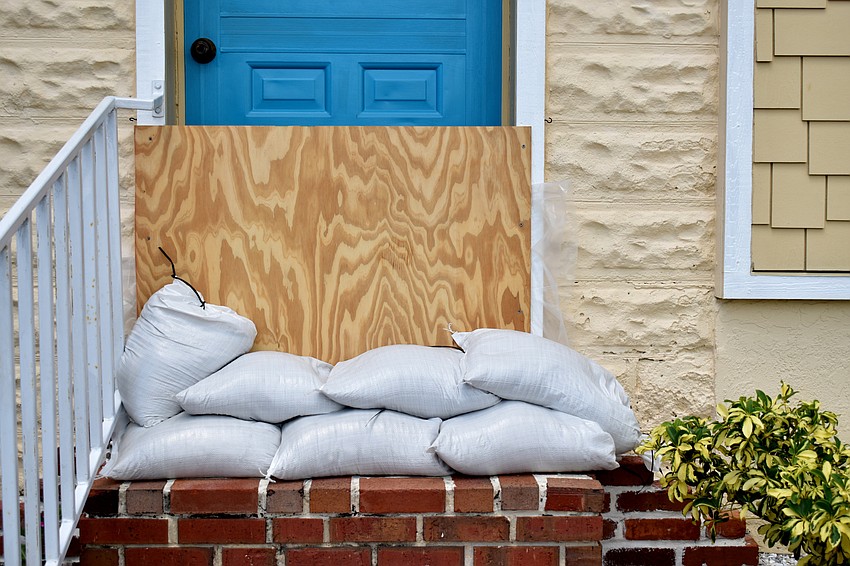 Some people board their doors and windows with plywood.