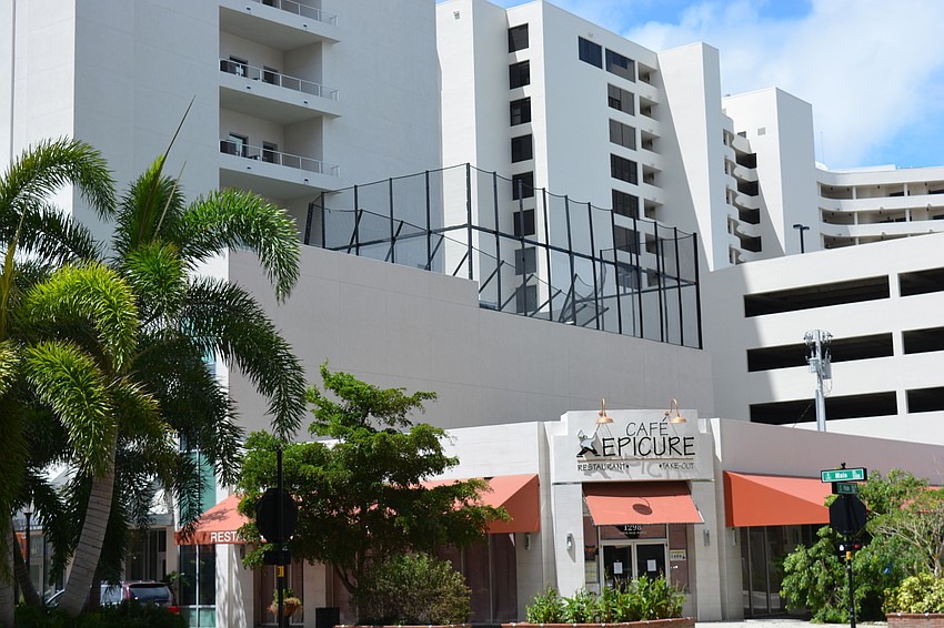 The Jewel condo's rooftop fence showed signs of the storm.