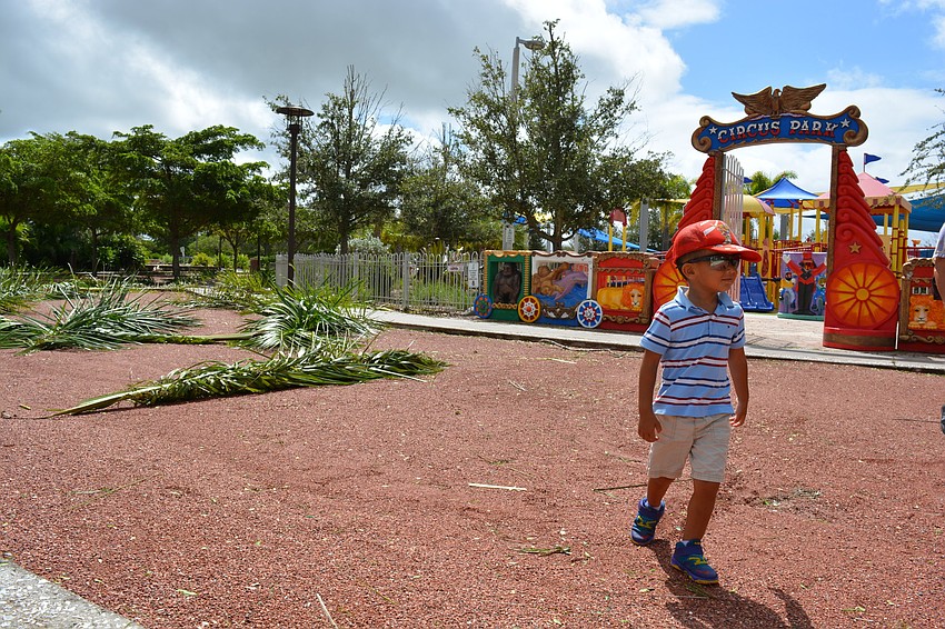 Kyle Huang leaves the Payne City playground. The Huang family was relieved to get outside after waiting out the storm in their Sarasota home.