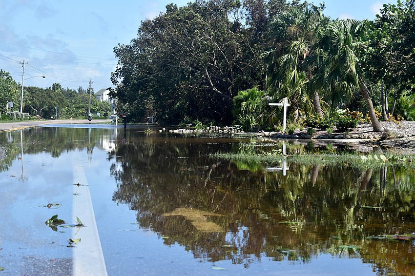 Minor flooding on Gulfside Road was spreading onto Gulf of Mexico Drive on Sept. 11.  Photo by Katie Johns