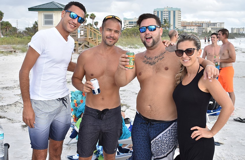 Yamen Elsaid, Robert Kecskes, Loyal Dodd and Judit Turan party on Lido Key Beach after Hurricane Irma. Photo by Niki Kottmann