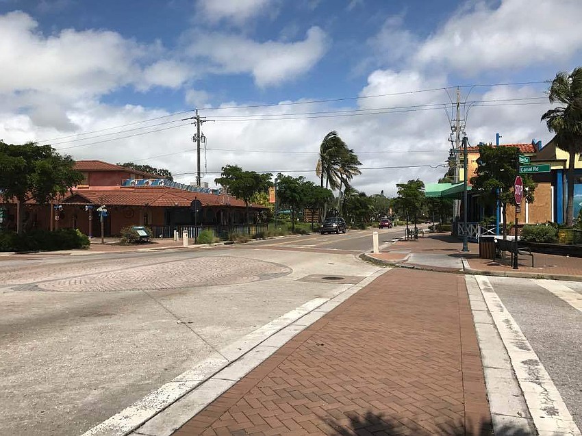 Businesses in Siesta Key Village sustained only minor damage from the storm, though it was deserted Monday.