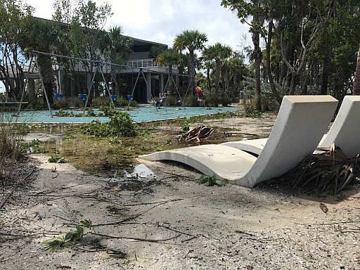 Storm debris didn't stop some beach goers from using the playground equipment.