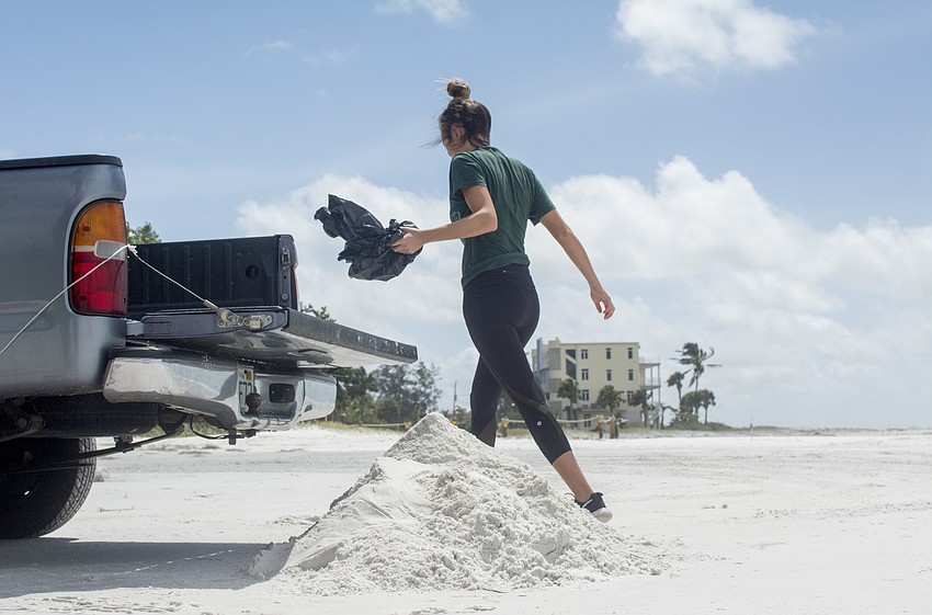 Some residents returned sand to the beach after filling their own sandbags, although this practice is technically illegal.