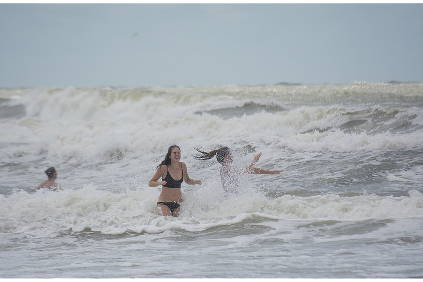 Megan Close, 19, and Lydia Mugford, 21, from Brighton, United Kingdom go for swim shortly after Hurricane Irma passed over Sarasota late Sunday night.