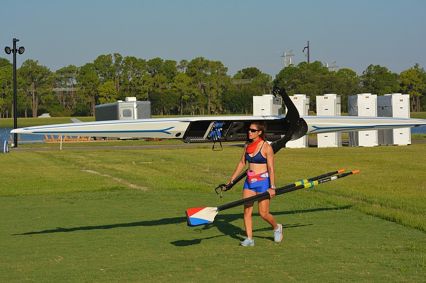 Paraguay's Alejandra Alonso has it worked out so she can carry everything to the dock in one trip for her workout.