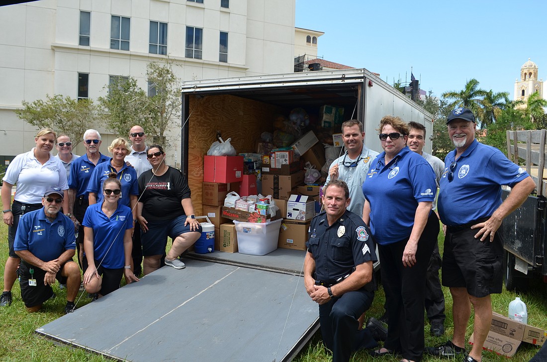 Sarasota Police Department volunteers, led by Sgt. Bruce King, packed four trailers and two semi-trucks with donated supplies to bring to the Florida Keys.