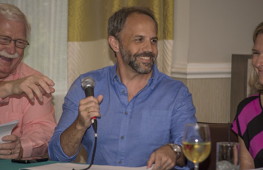 Sam Lowry judges the YPG Spelling Bee at Hotel Indigo on Sept. 19.