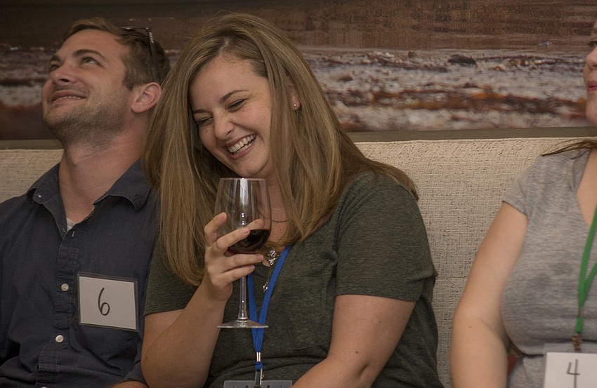 Jamie Minton laughs during Miss Beneva Fruitville's introduction.