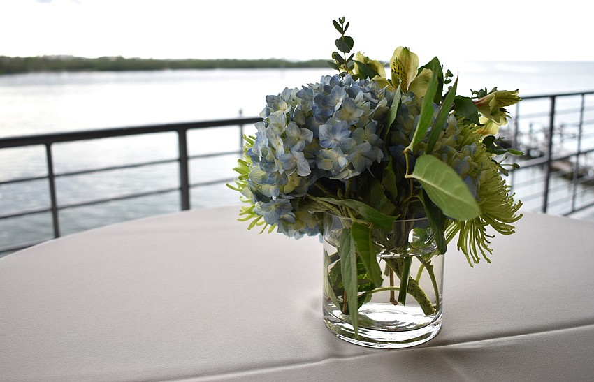 Outdoor tables were adorned with floral centerpieces at the Eat Like a Local Restaurant Week Kickoff Event on Sept. 20 at Keating Marine Education Center.