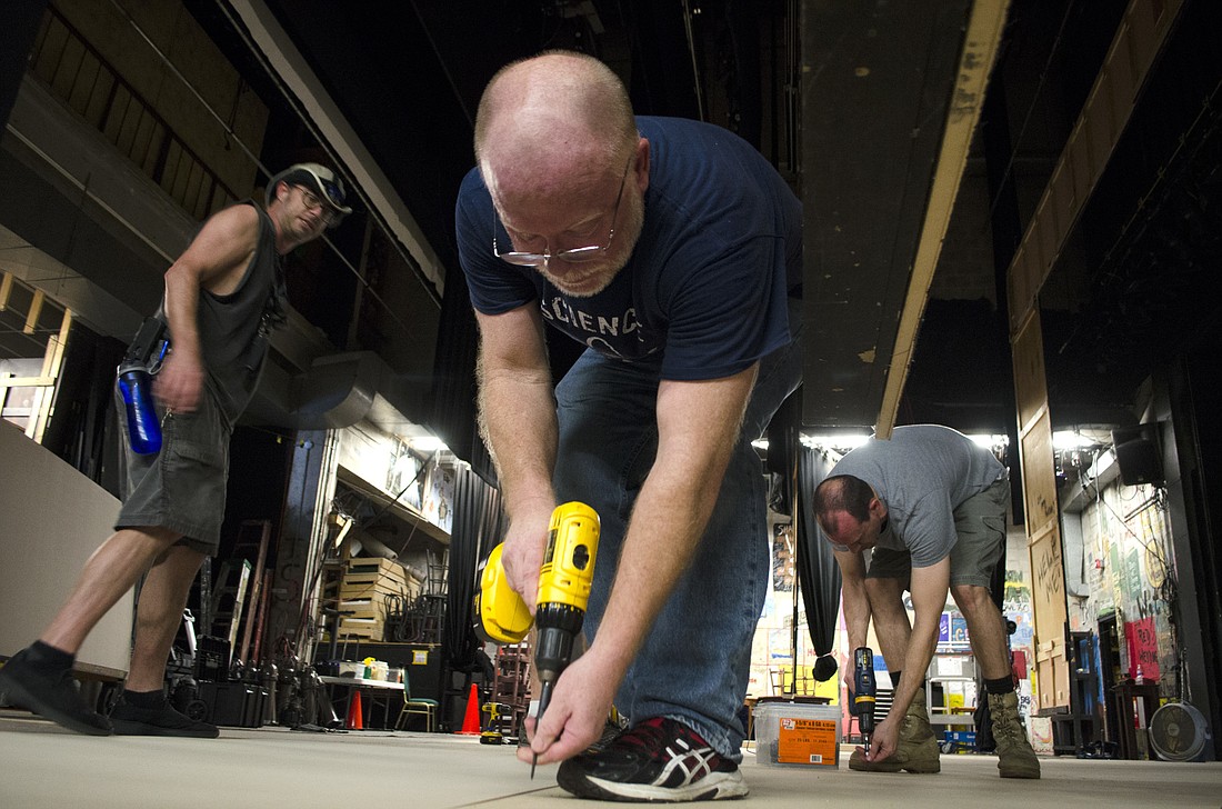 Dozens of volunteers, including members of Venice Theatre, arrived at the Players Centre for Performing Arts to help replace a water-damaged floor.