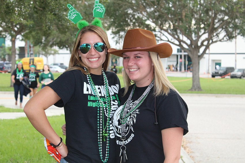 Lakewood Ranch High School seniors Kylie Duquette and Grace Reeves come dressed to impress to the homecoming game.