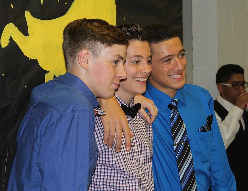 Lakewood Ranch High School sophomore Gavin Pittman, freshman Peter Fisichella and freshman Yancarlos Perez hang out at their homecoming dance.