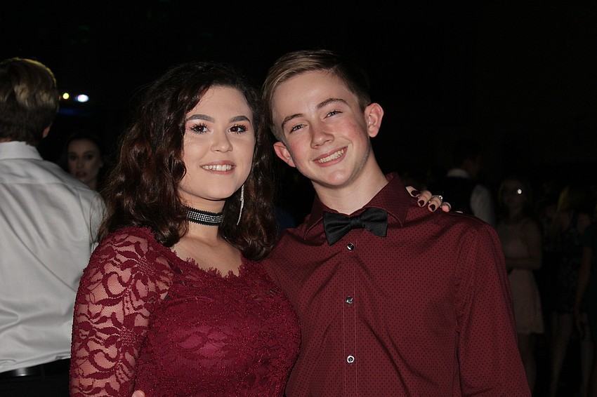 Lakewood Ranch High School freshman Caitlyn Pohler and Caleb Kershner move to the music in their matching homecoming attire.
