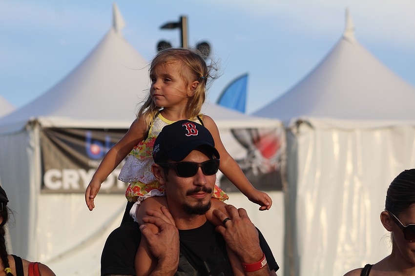 Sarasota's Taylor LaFlamme and Bill Lukas stroll around the park during Fan Fest.