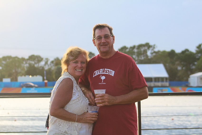 Palm Aire's Debbie and Jeff Burhans enjoy a drink by the water during Fan Fest.