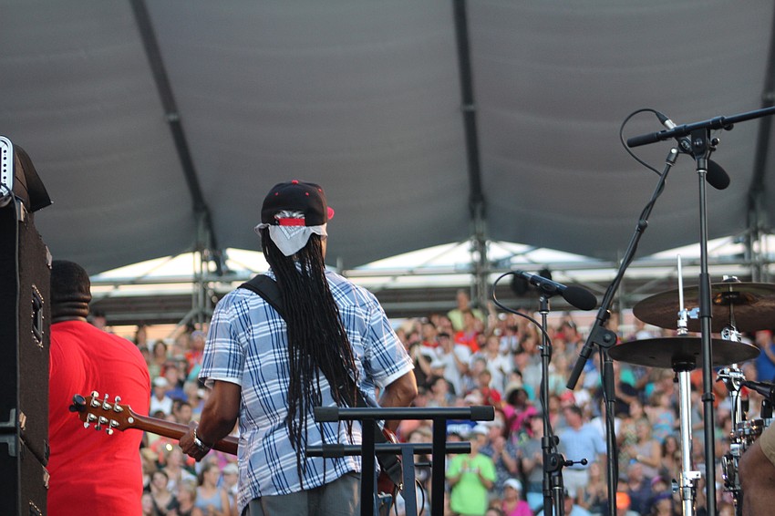 A Jah Movement band member looks at the crowd in the stands during  the World Rowing Championship opening ceremony.