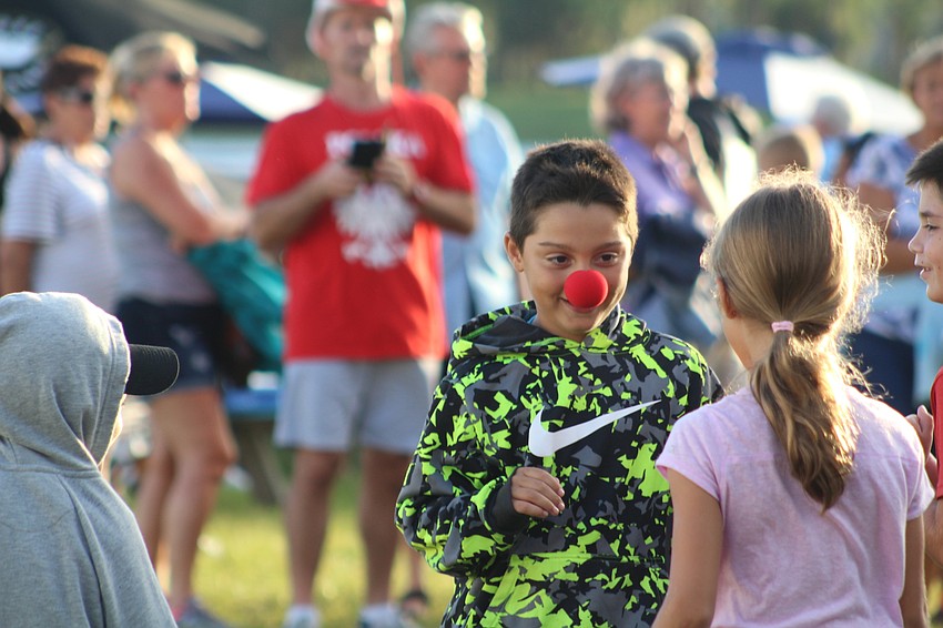 East County's Patrick Johnston wears a red clown nose around the park during Fan Fest.