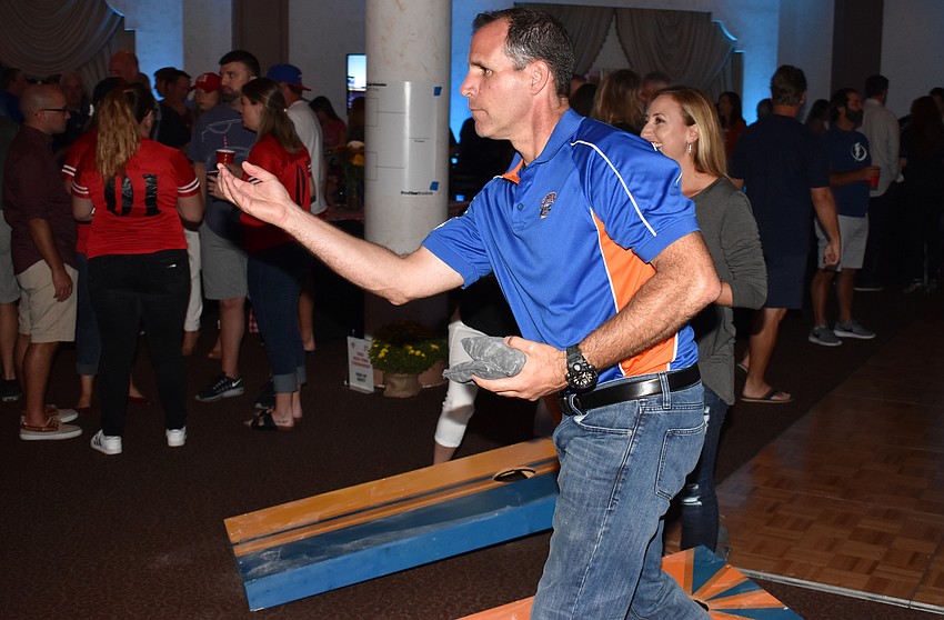 Kevin McElyea plays cornhole with his wife Candice at Totally Tailgate on Sept. 23 at Michael’s On East.