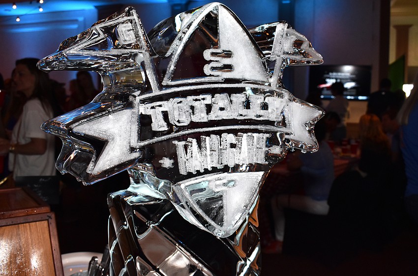 An ice sculpture with the event logo adorned a food table at Totally Tailgate on Sept. 23 at Michael’s On East.