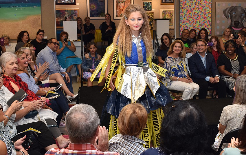 Sofia Scheck shows off her outfit during the iconcept jr. fashion show on Sept. 24 at Art Center Sarasota.