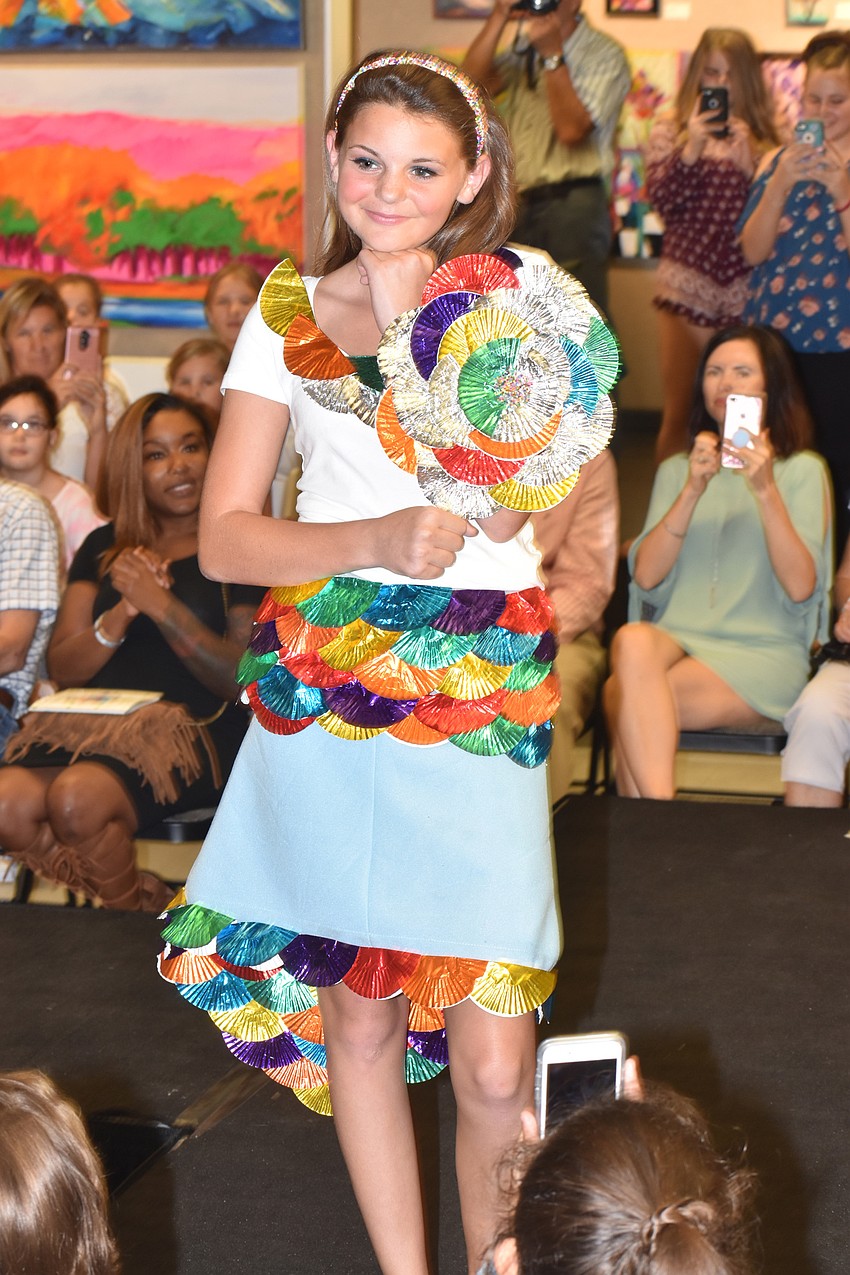 Alyssa Currier models Lacey Currier and Marissa Fraser’s outfit during the iconcept jr. fashion show on Sept. 24 at Art Center Sarasota.