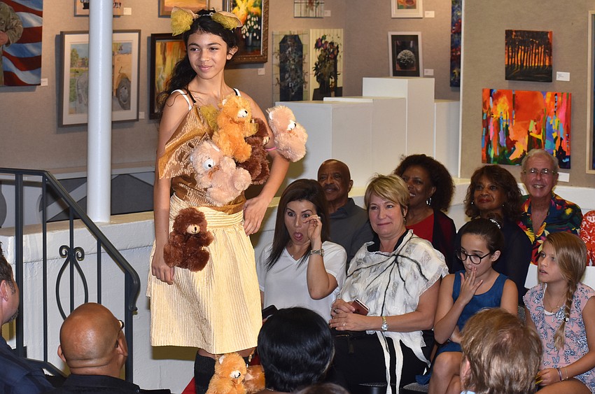 Ava Abreu shows off her bear-themed ensemble during the iconcept jr. fashion show on Sept. 24 at Art Center Sarasota.