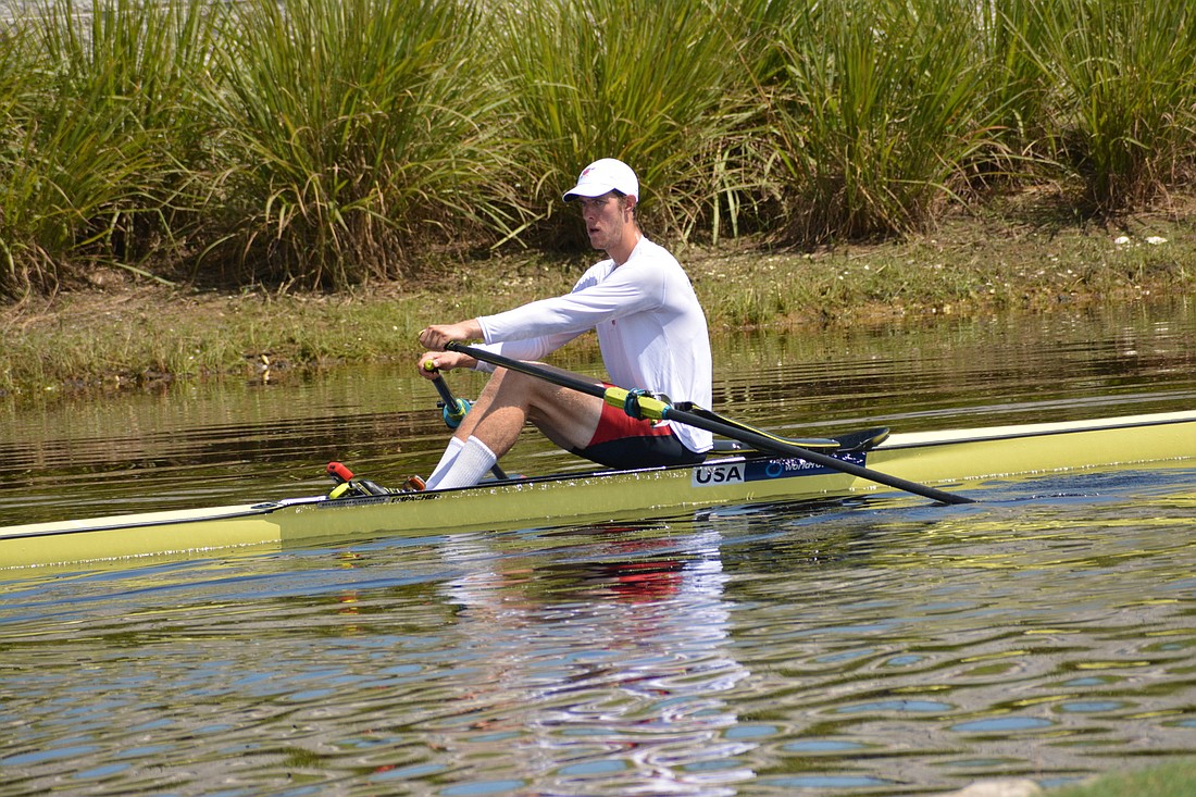 Michael Clougher rows back to shore after winning his men&#39;s single scull (1x) repechage.