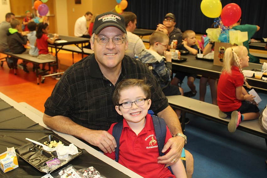 Tony Monterosso hangs out with his grandson Brady Denault, a first-grader at Braden River Elementary, for breakfast before school.