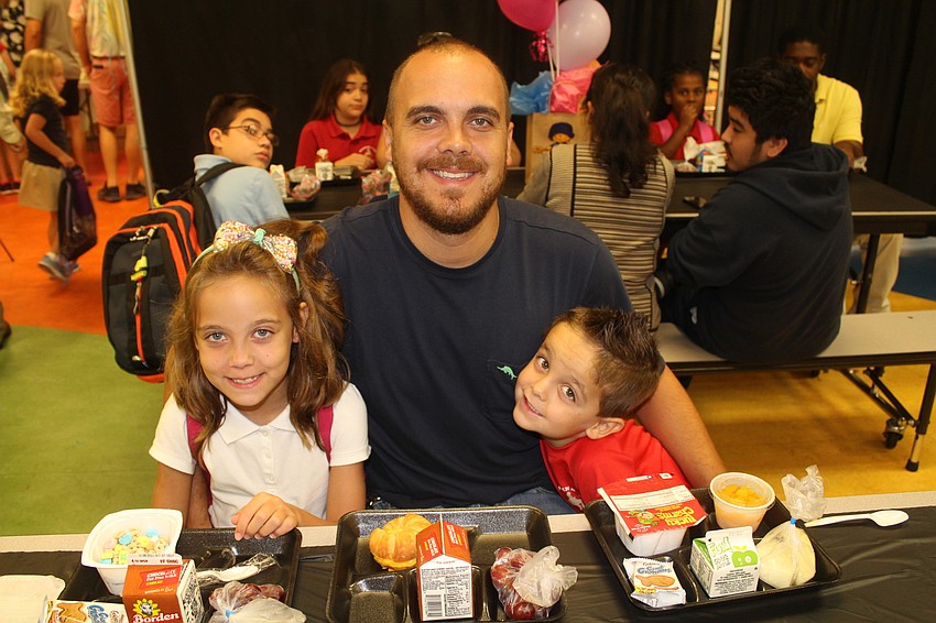 Braden River Elementary School students Gracie Miller, Cameron Miller and McCoy Miller eat breakfast as a family before school begins.