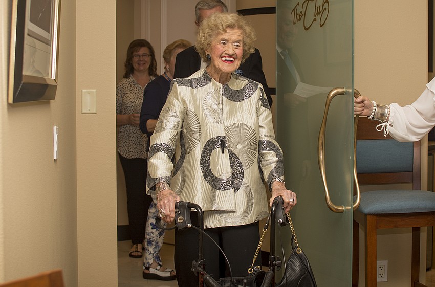 Betty Schoenbaum enters her birthday celebration.