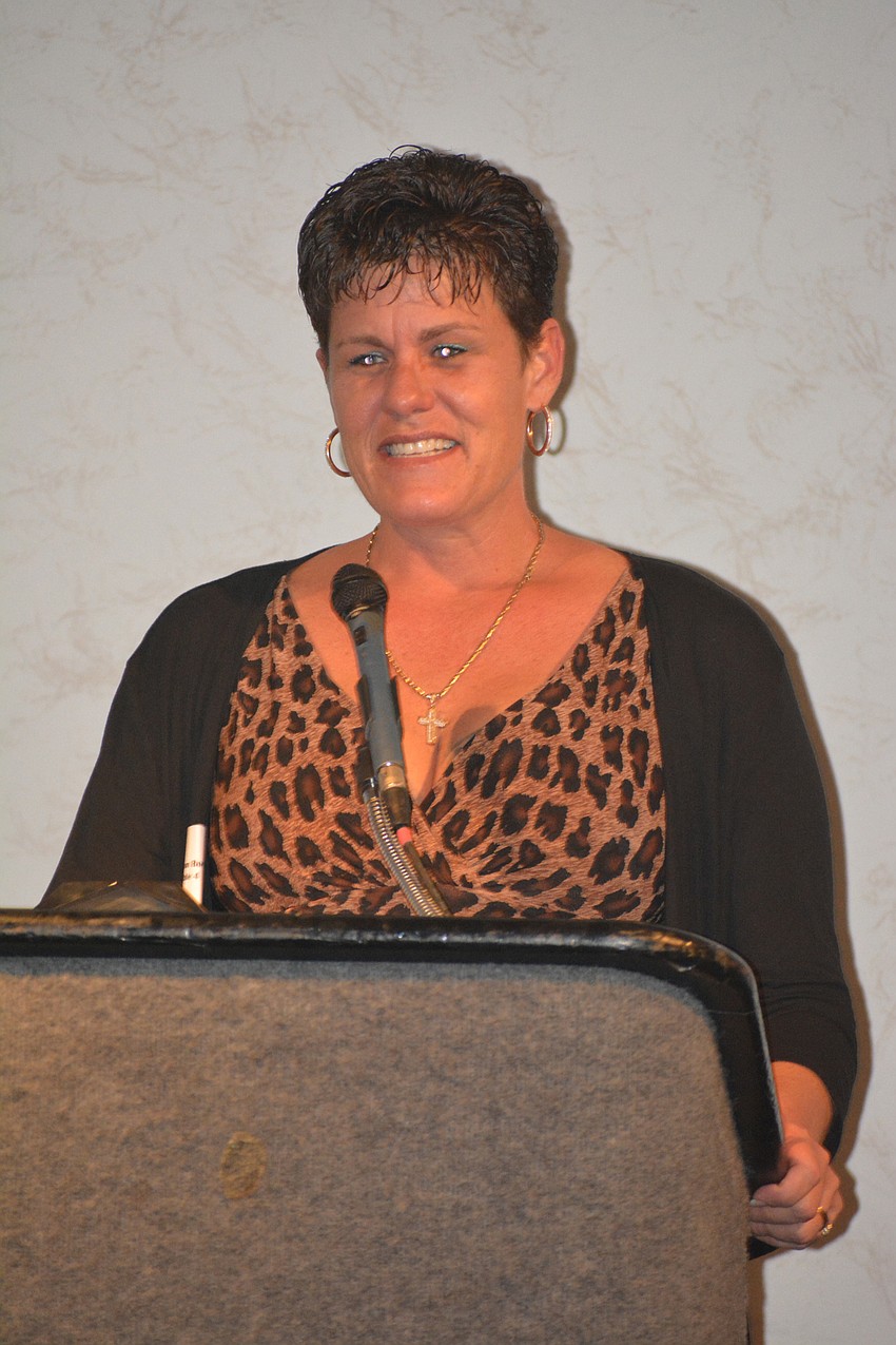 Shannon Howell Rosier accepts the Eddie F. Howell Award on Excellence on behalf of her father.