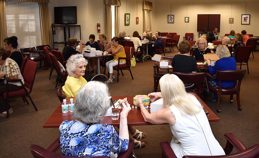 Guests eat lunch before listening to Lucia Blinn's Salon Series lecture on Sept. 28 at Designing Women Boutique.
