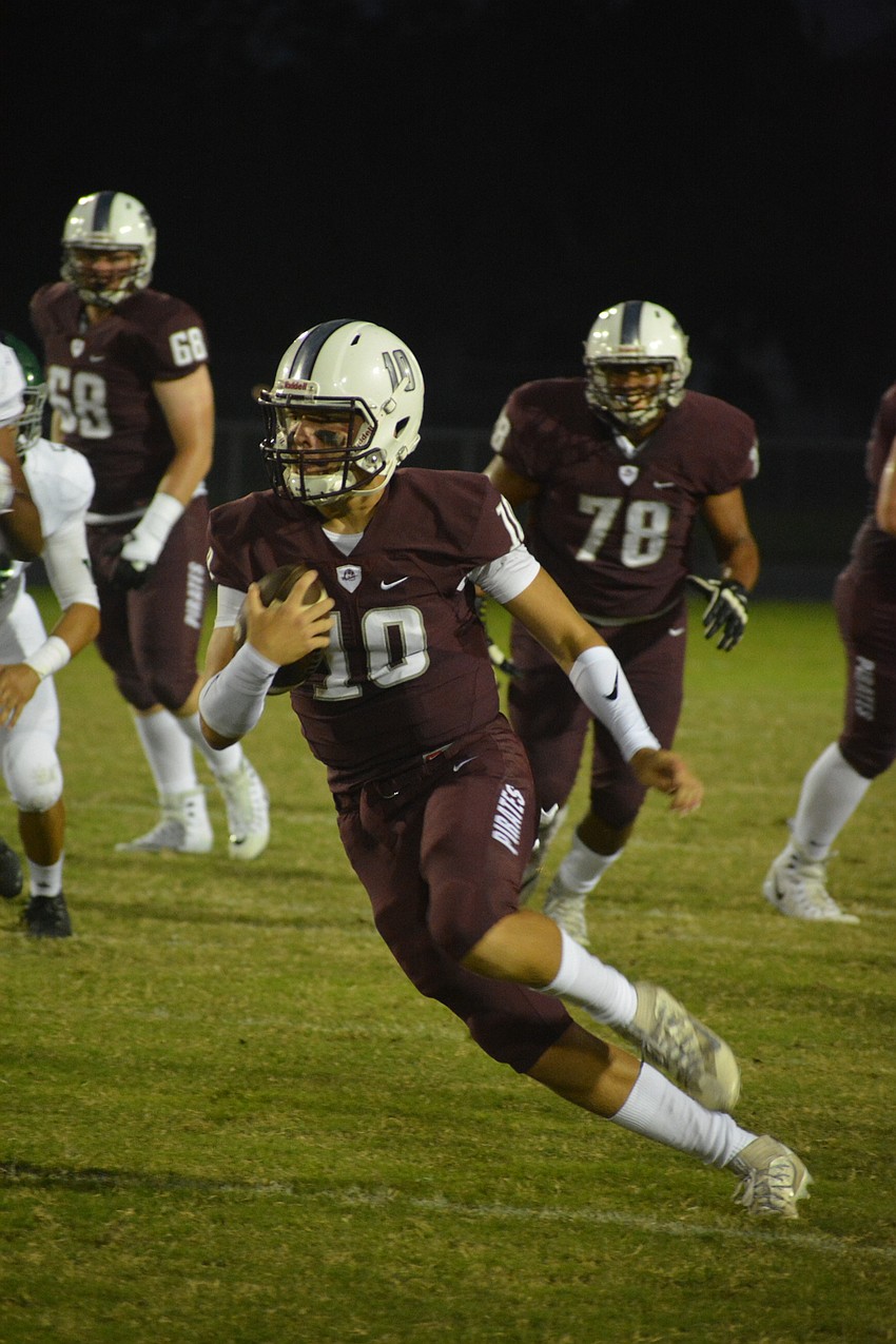 Junior quarterback Bryan Gagg scrambles for a first down.