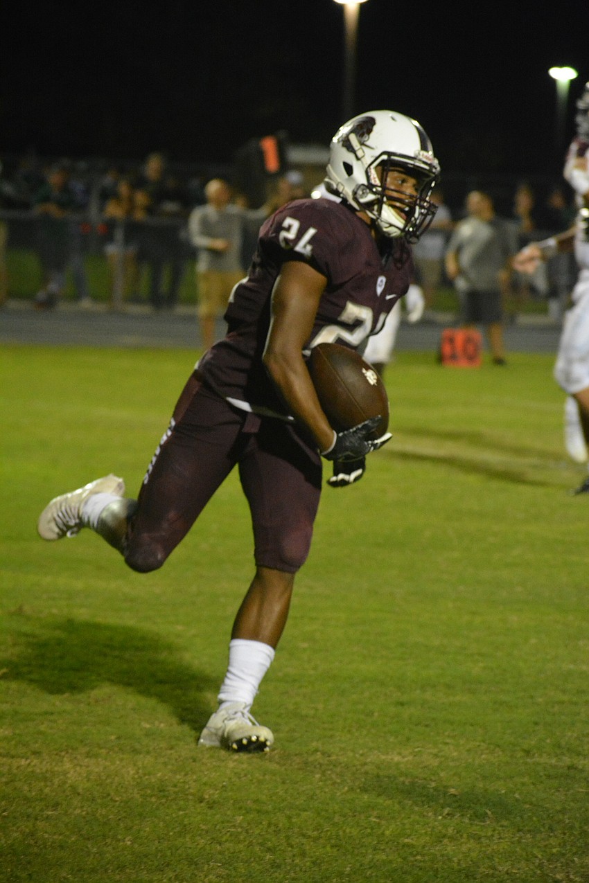 Junior running back Camaron White celebrates a touchdown.